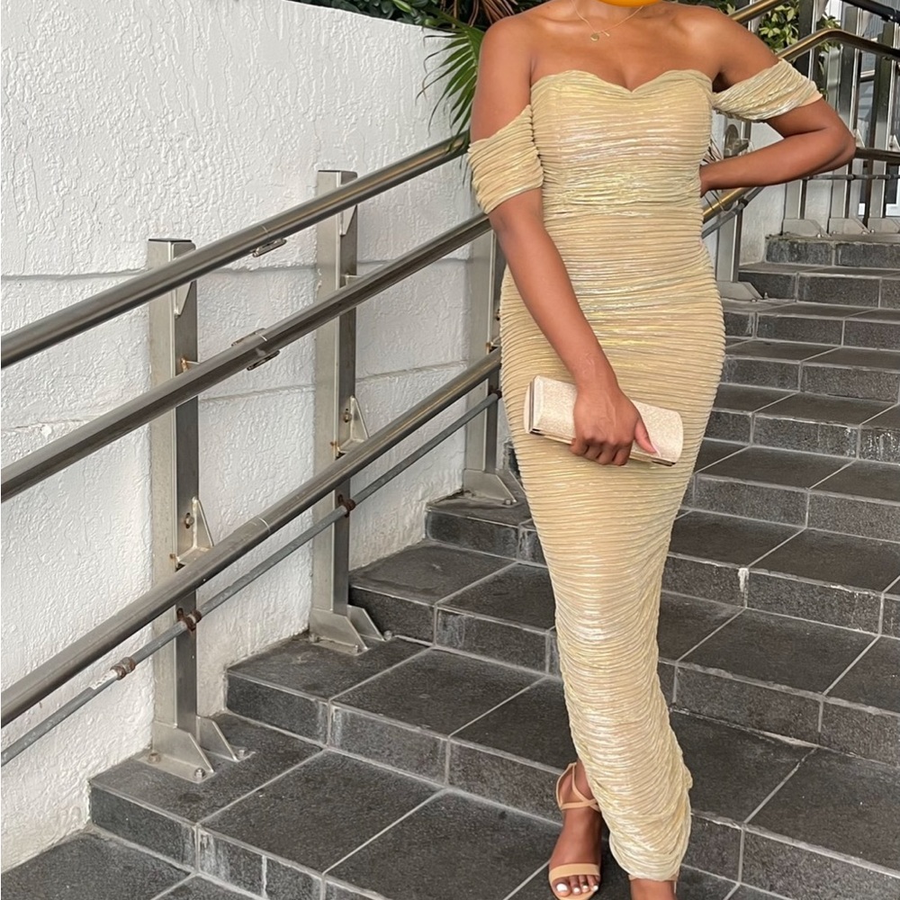 Stunning gold gown by Miss Circle